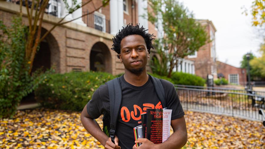 Student holding their books 